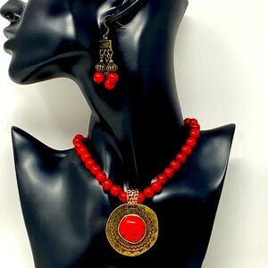 Red howlite necklace and earrings in antique gold